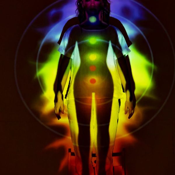 Stylized silhouette of a human body with energy lines.